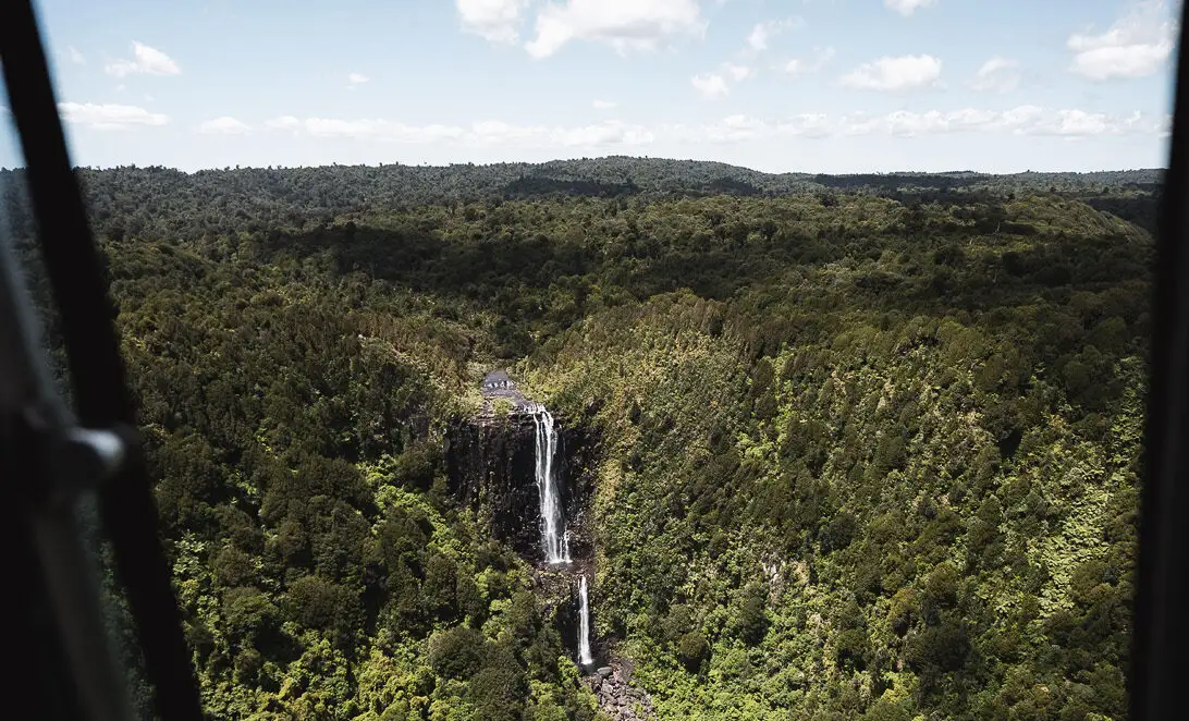 Kaimai Ranges waterfall and native forest viewed from a scenic flight in Bay of Plenty